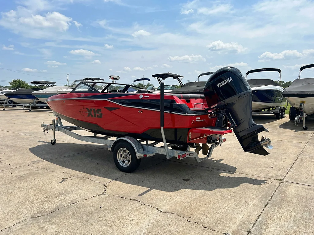 2022Axis-_0002_freepik__a-red-and-black-2024-axis-a225-is-parked-on-a-trai__76086