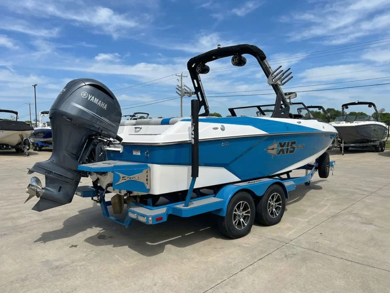 2024Axis-_0000_freepik__a-blue-white-2024-axis-a225-is-parked-on-a-trailer__76068